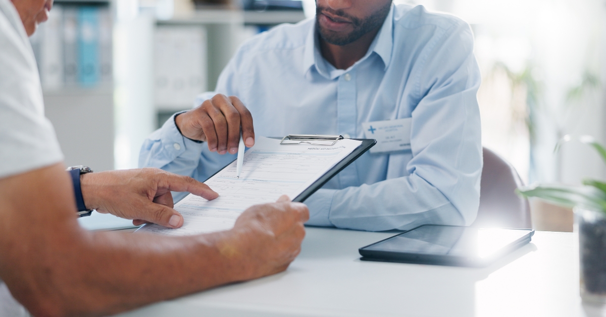 paperwork to patient at clinic