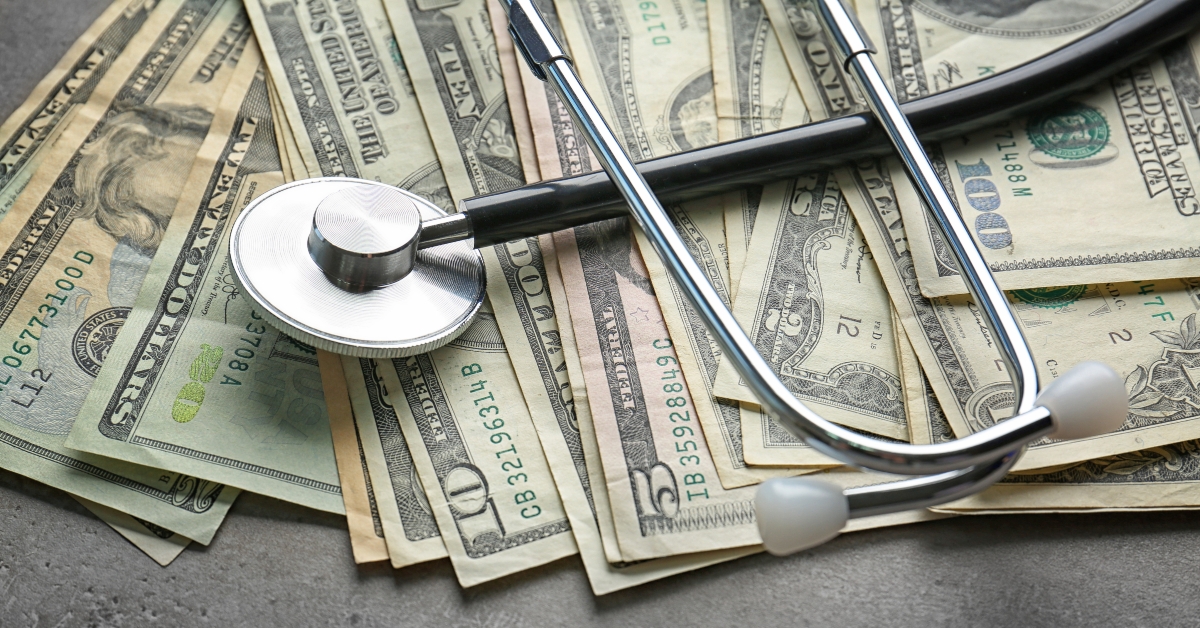 American dollars and stethoscope