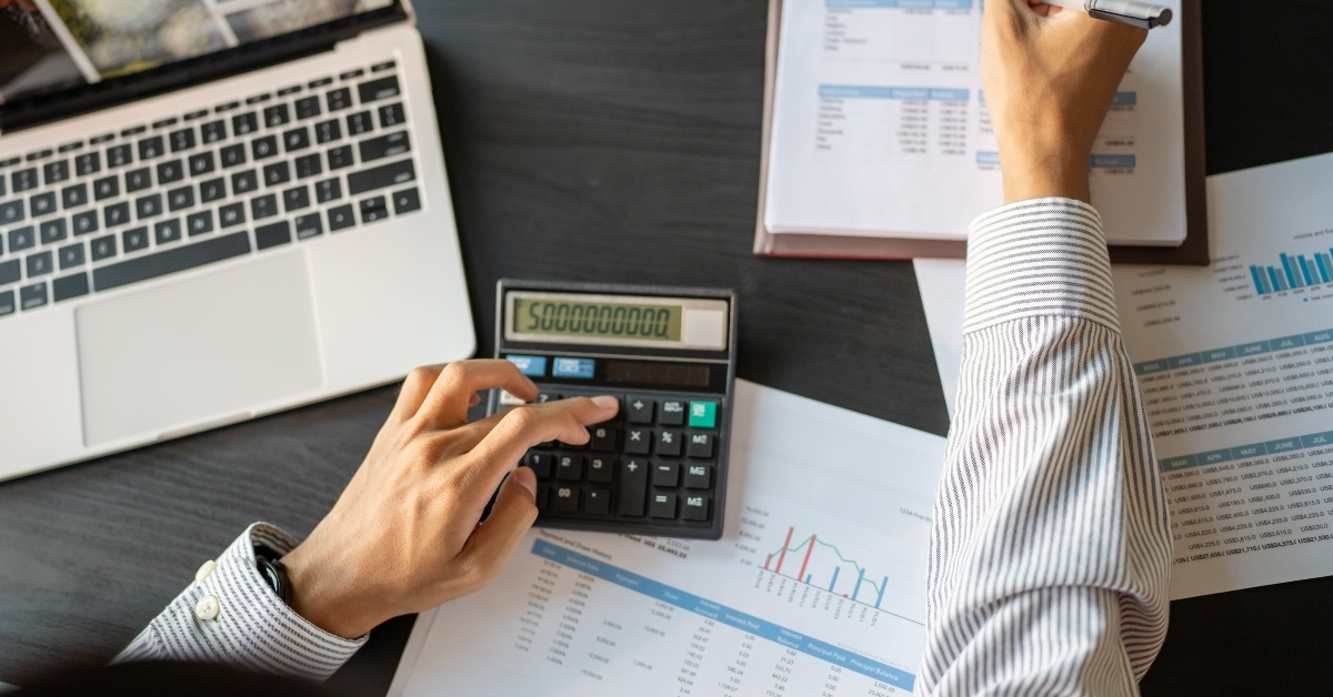 business men checking annual financial statements