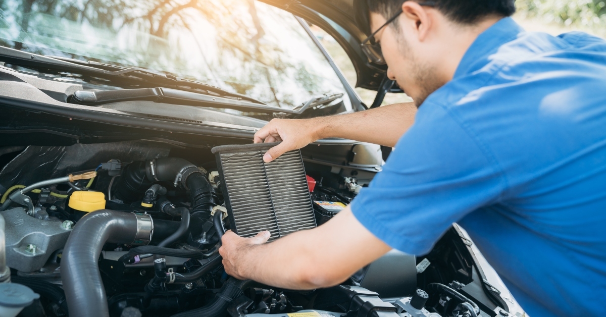 man checking and maintenance air filter on his car