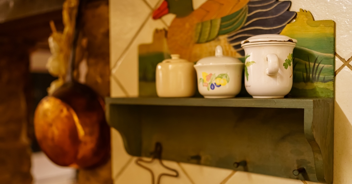 antique kitchen utensils shelves with canisters for food and spices