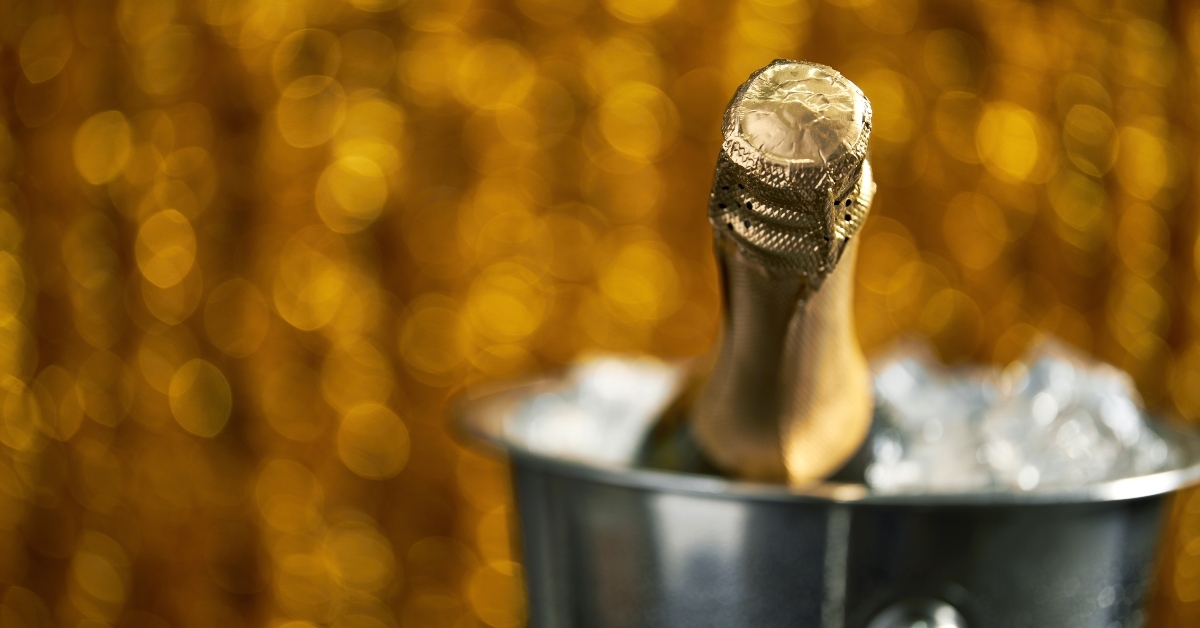 bottle of champagne in a bucket with ice