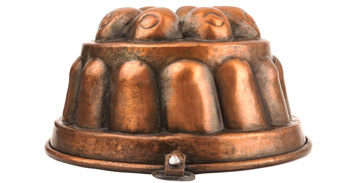 copper jelly mould on a white isolated background
