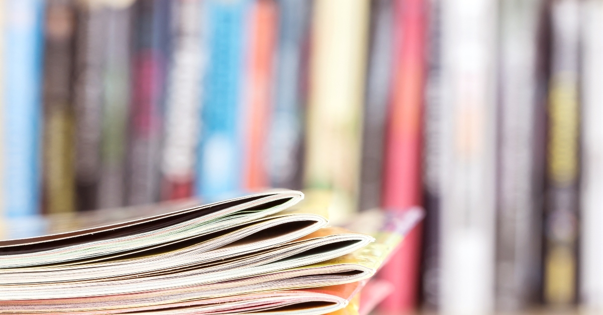 close up edge of colorful magazine stacking