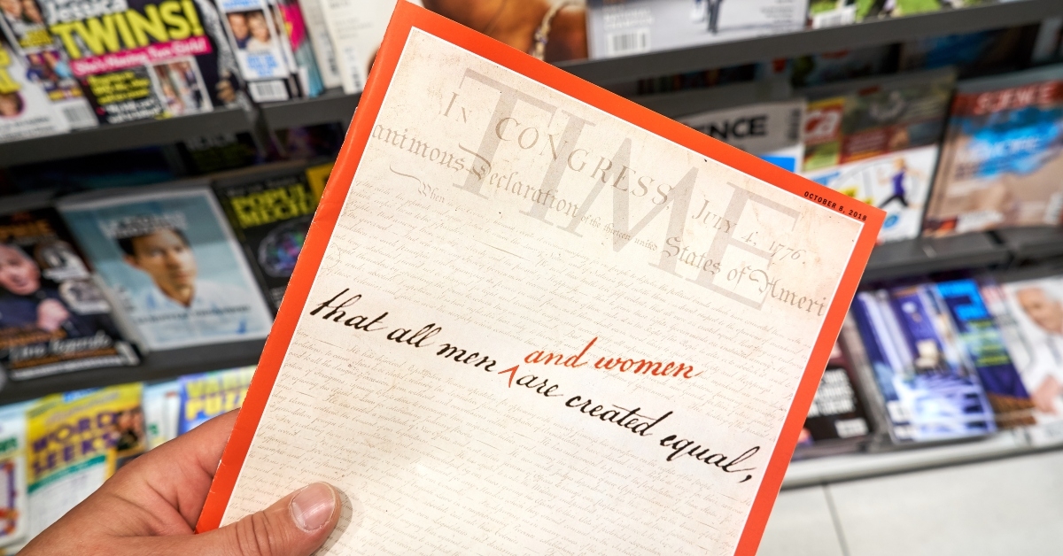 time magazine in a hand