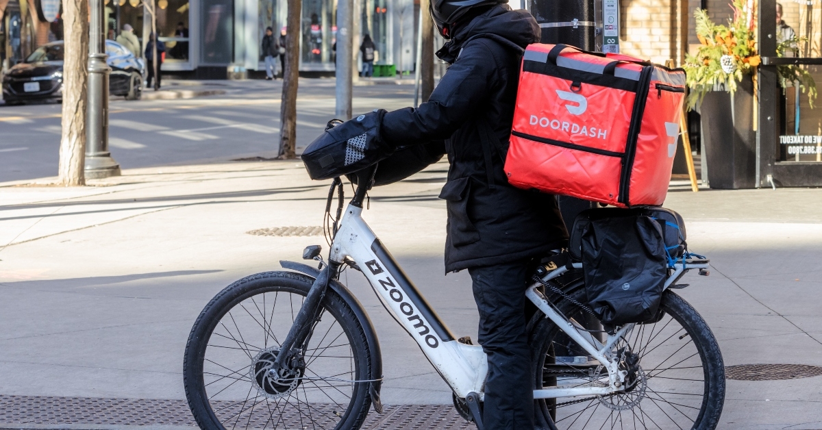 delivery courier on an electric bicycle