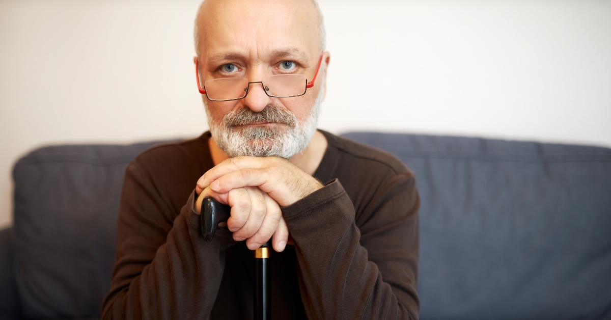 portrait of serious wealthy aged man