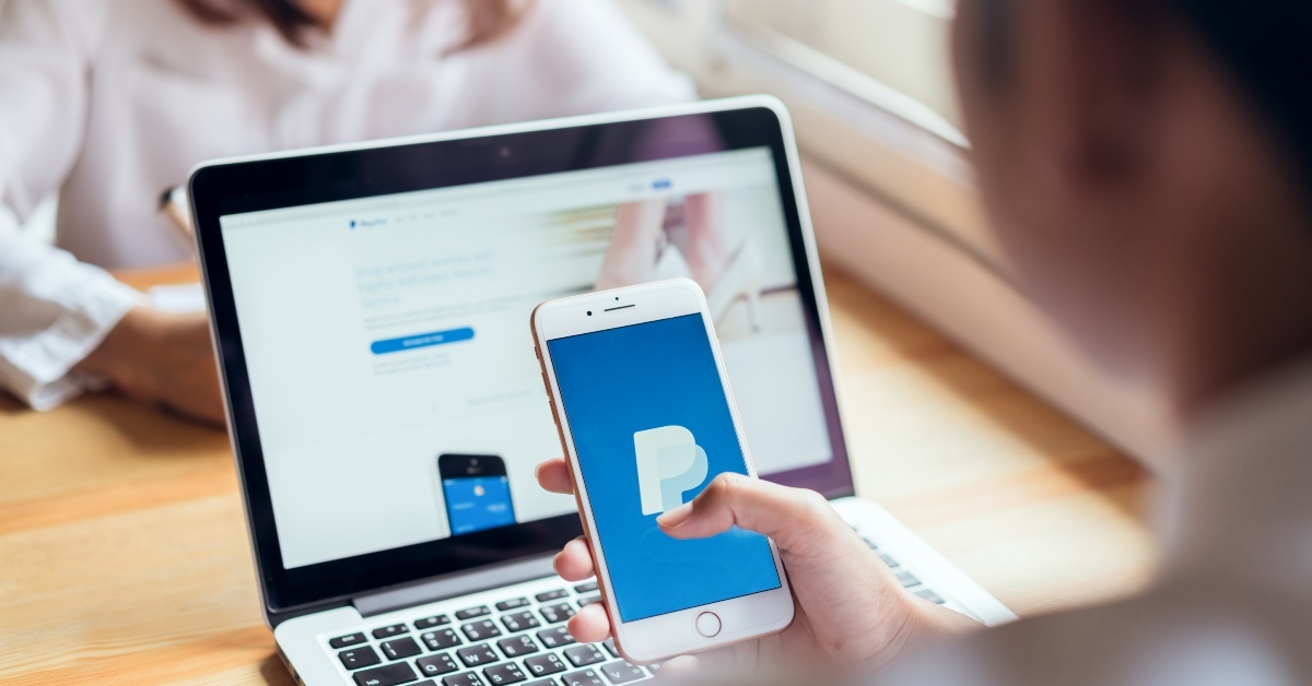 smartphone on the table showing screen paypal