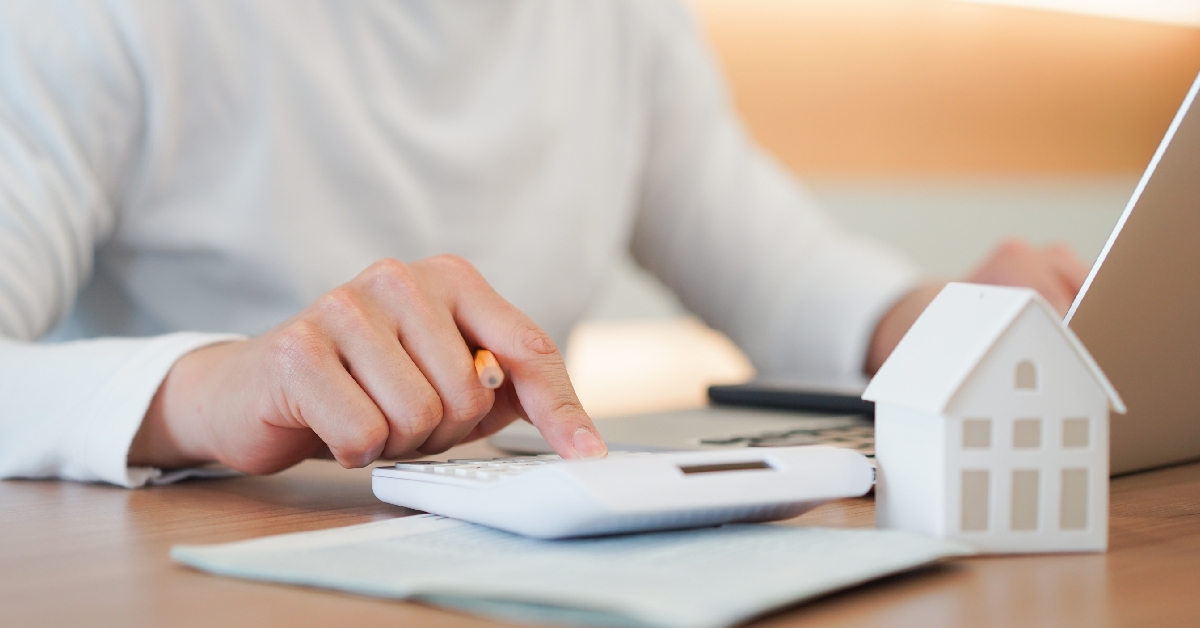 man calculating the summary expense of home loan