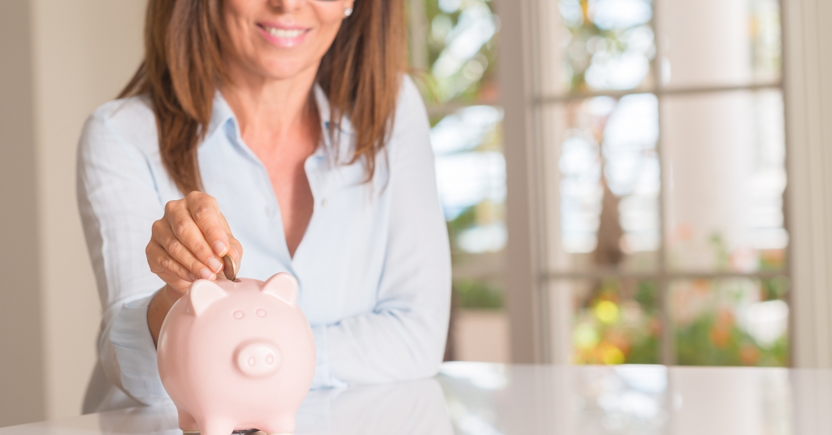 middle age woman with piggy bank