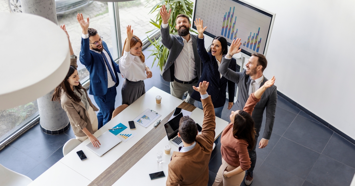 Top view of successful group celebrating success