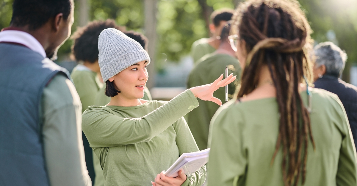 female manager giving recycling teamwork orders