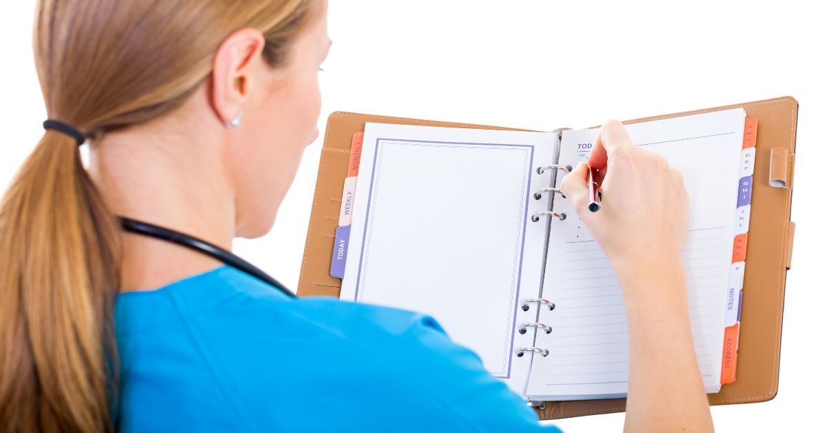 Young doctor writing report