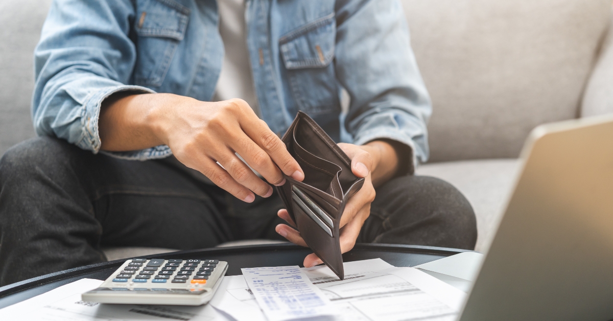 man opening empty wallet