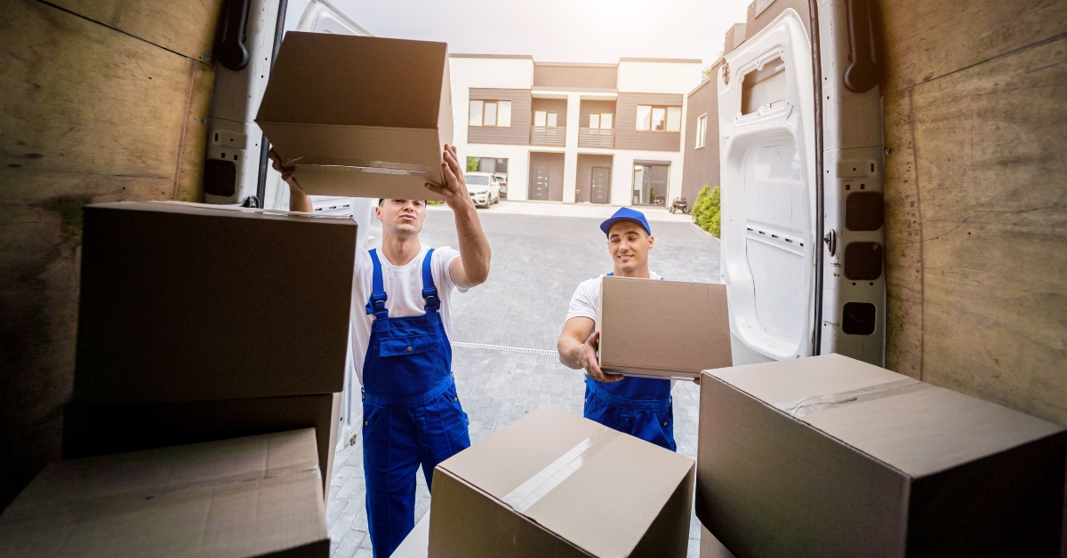 workers unloading boxes from minibus