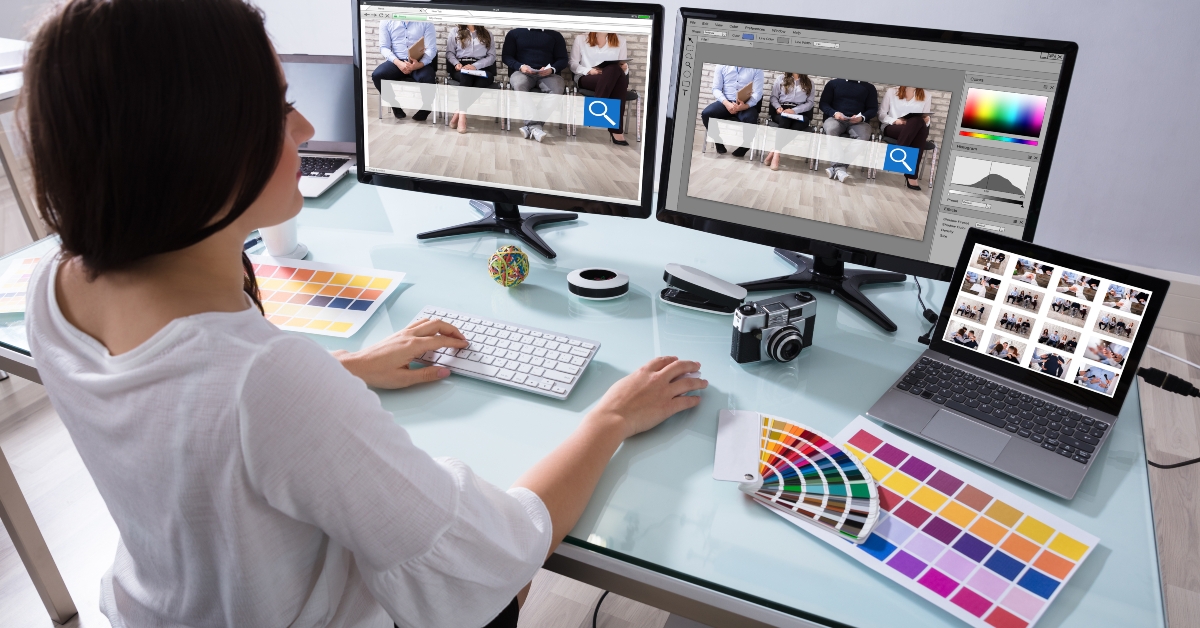 female designer working on multiple computer