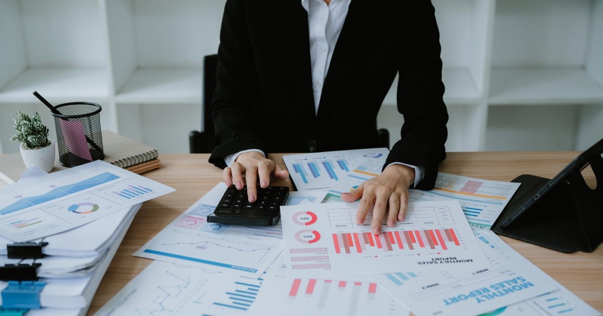 businessman hand using calculator