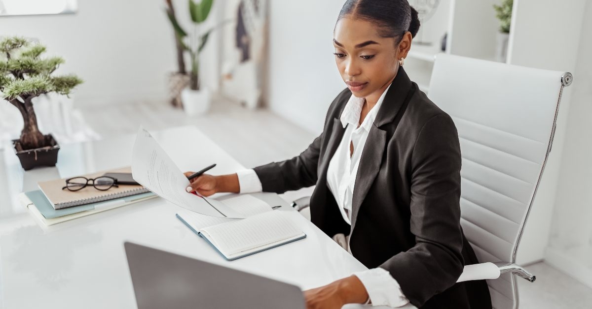 female hr manage using laptop
