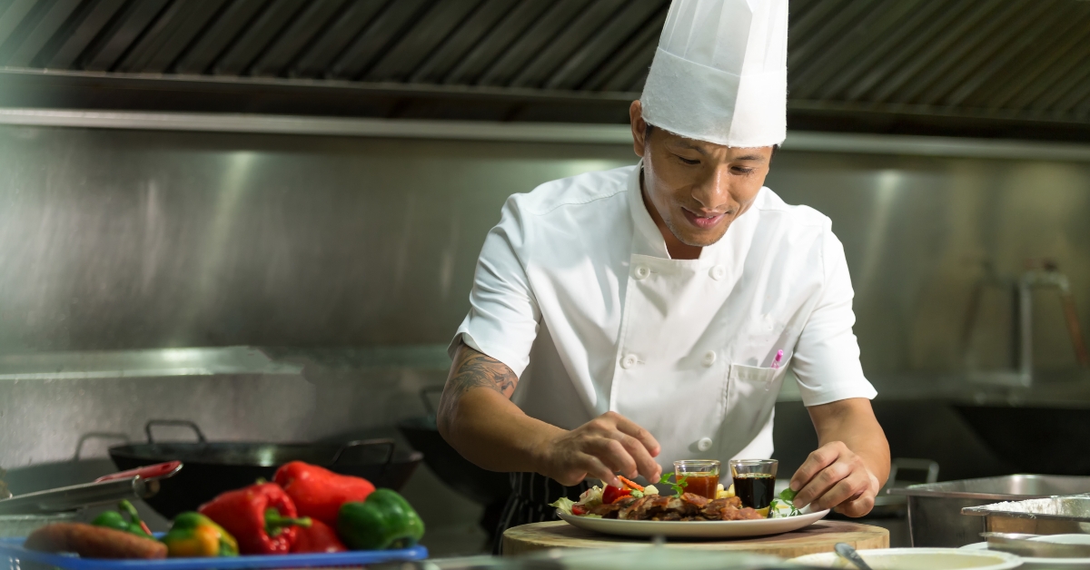 male chef with cooked food