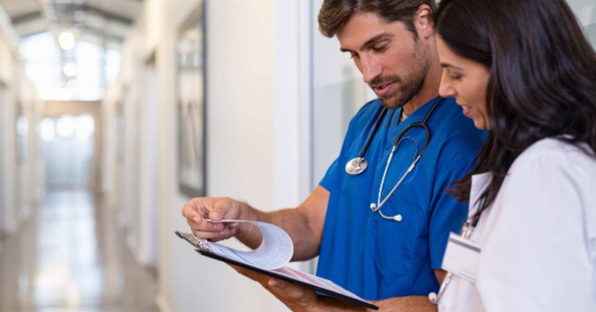 doctor and nurse discussing medical report