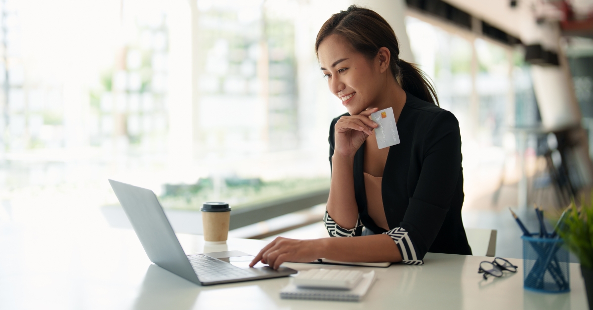 girl holding bank credit card