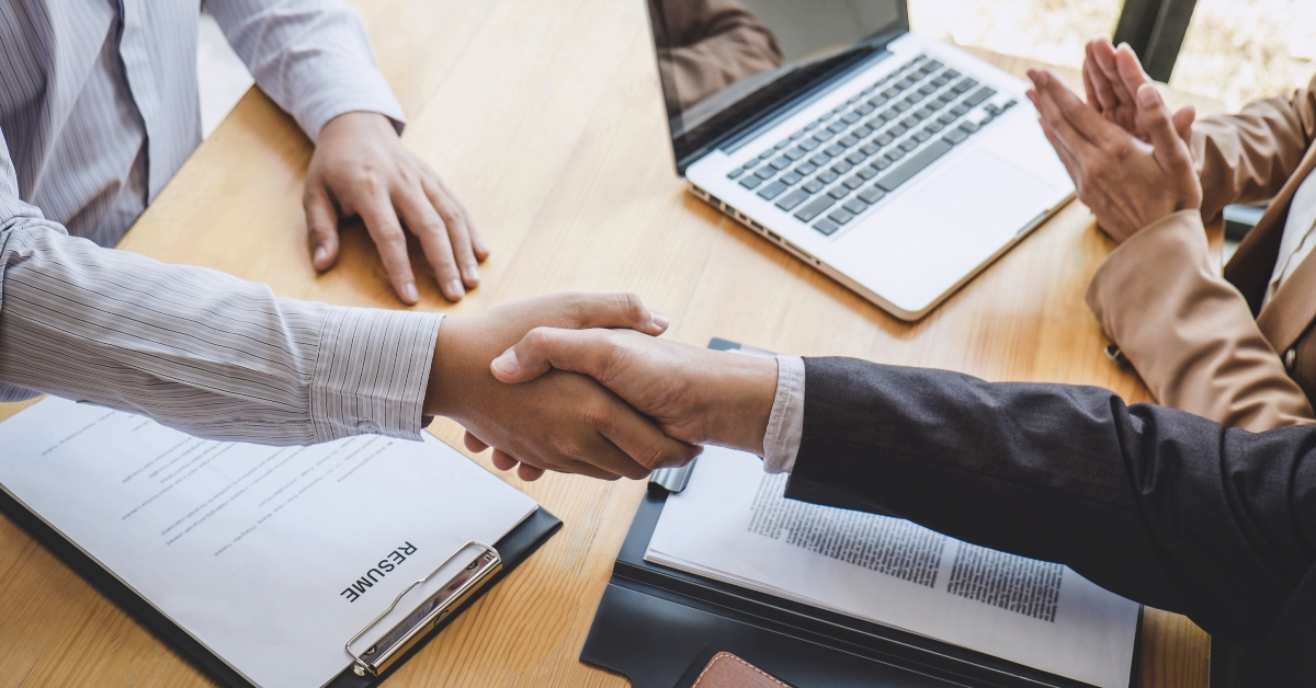 greeting new colleagues with handshake