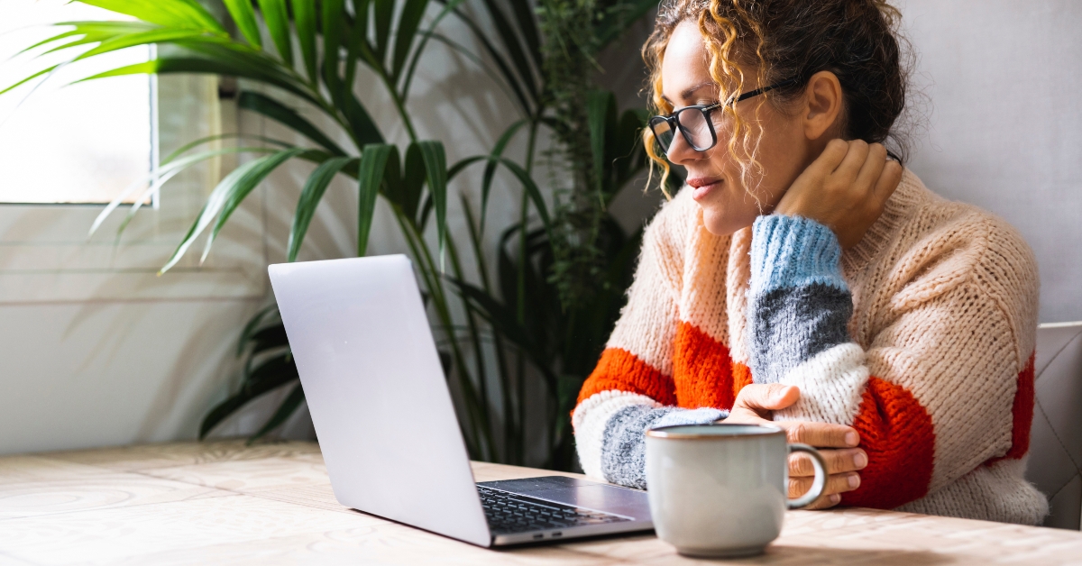 woman looking and reading online notification email
