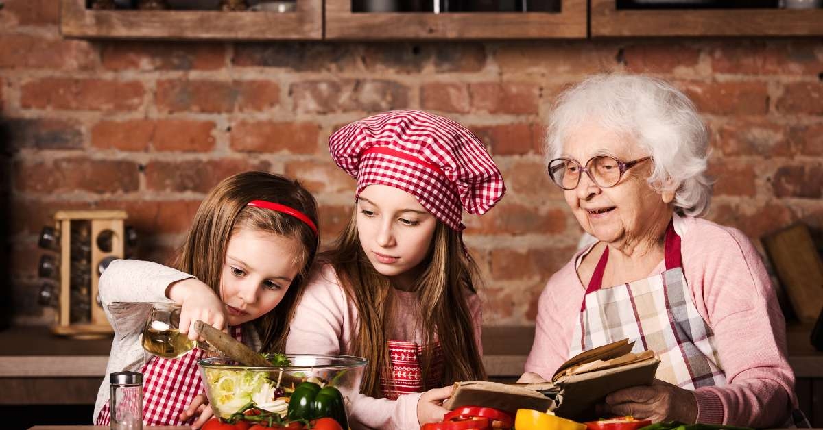 two little sisters with granny cooking