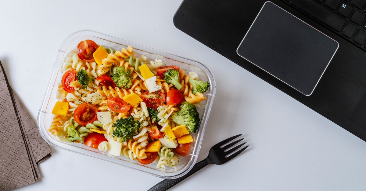 Healthy food in lunch box, on working table