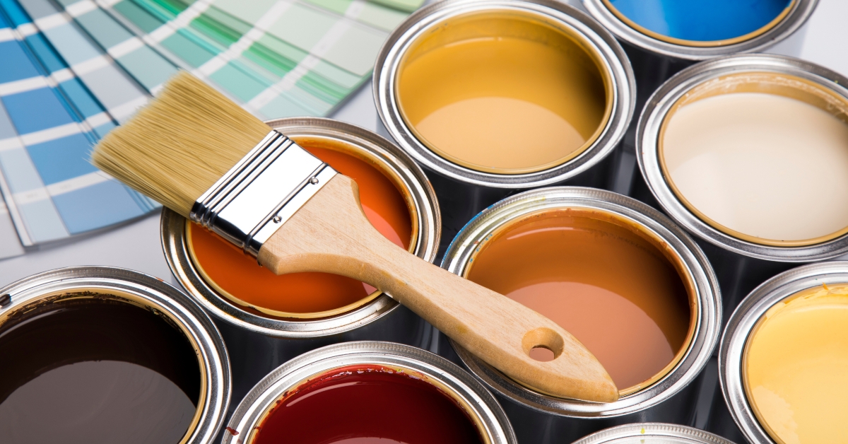Colorful paint cans with paintbrush