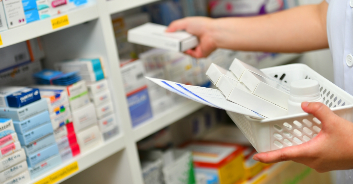 Pharmacist filling prescription in pharmacy drugstore