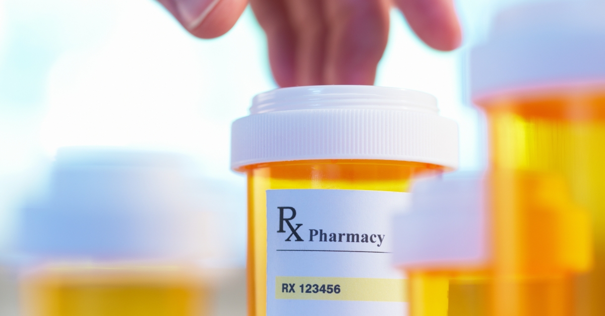 Prescription bottle and hand with motion blur