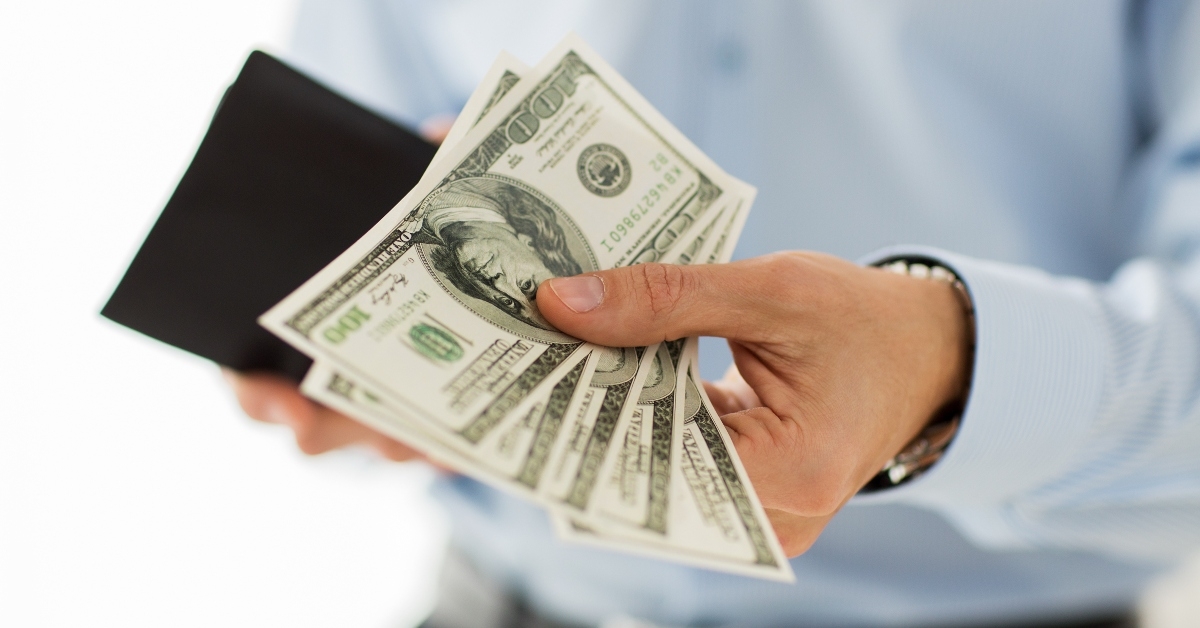 businessman hands holding money