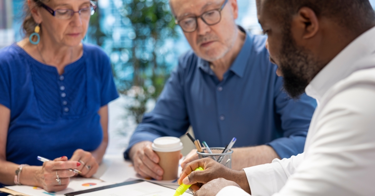 discussing with senior couple