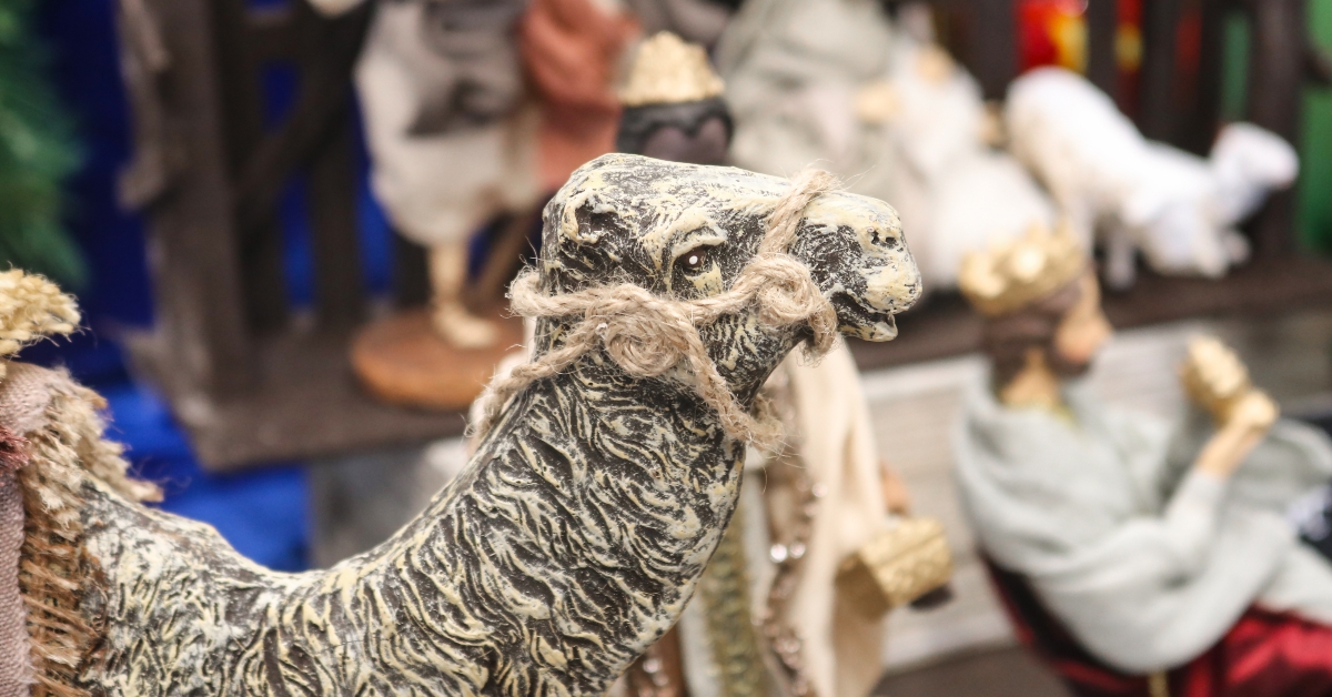 camel figurine with blurred figures