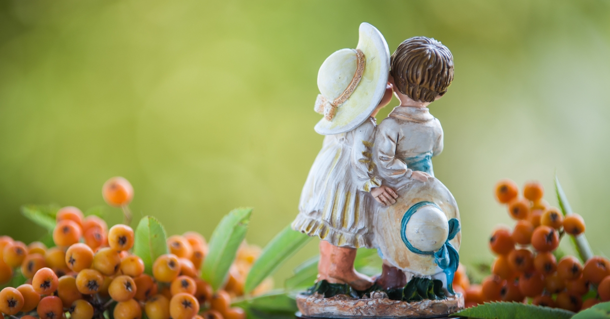 figurine of a boy and a girl