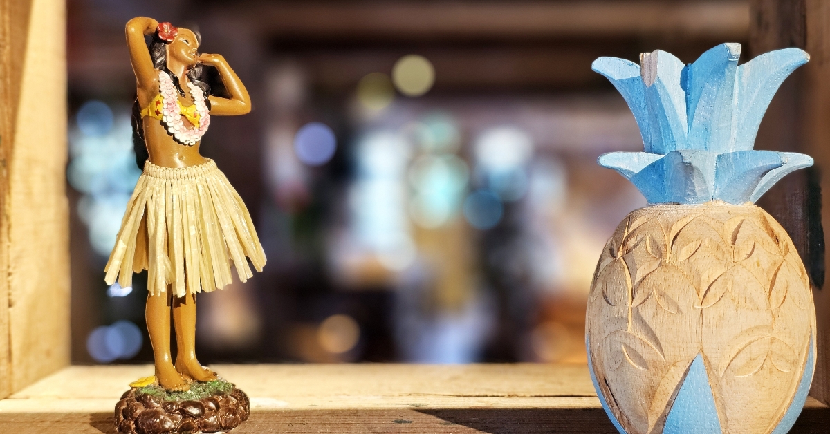 hawaiian hula doll and wooden pineapple