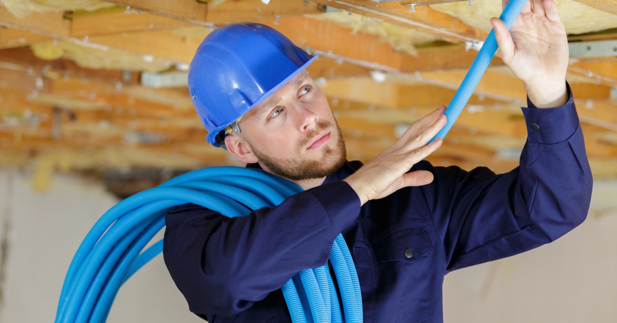electrician working with wires in construction site