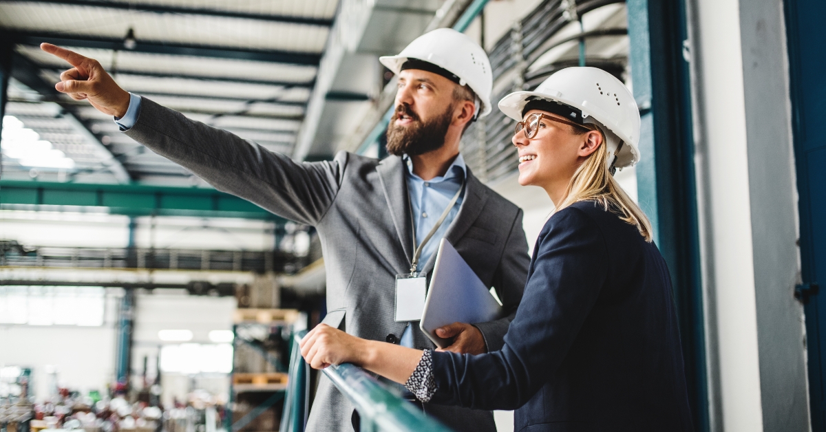 man and woman engineer with tablet