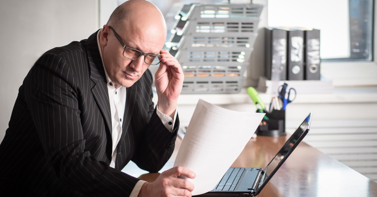 businessman reading paper document