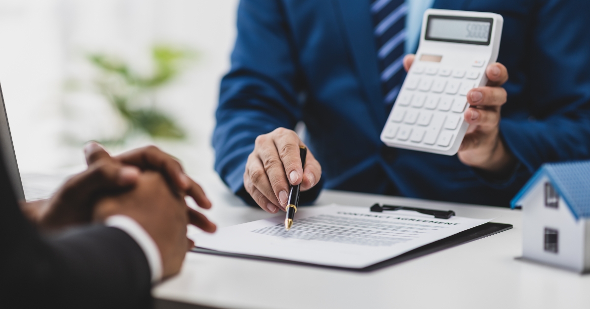 real estate agents discuss house sale