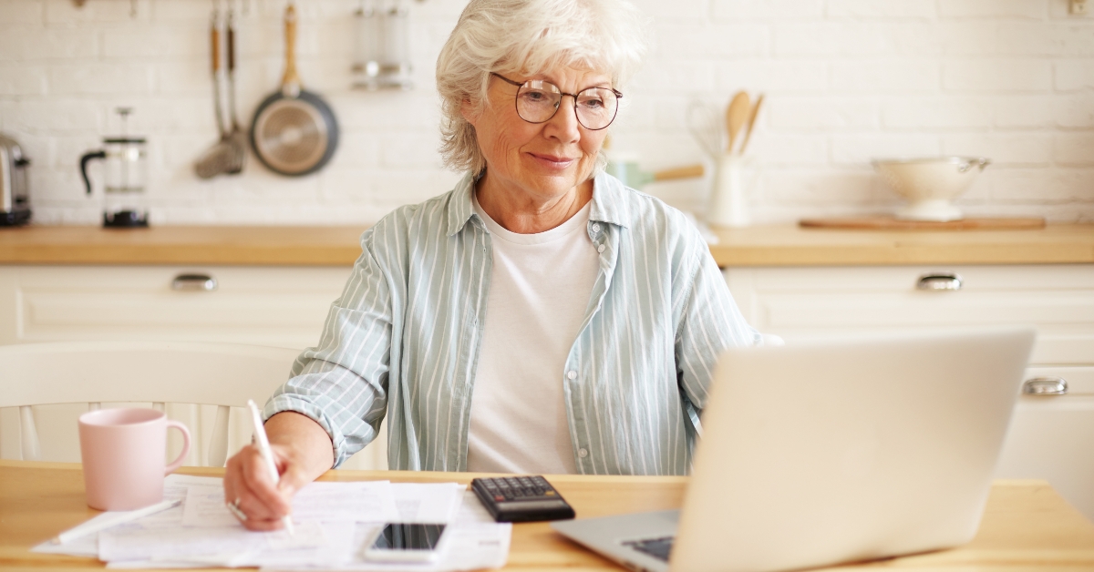 senior woman paying bills