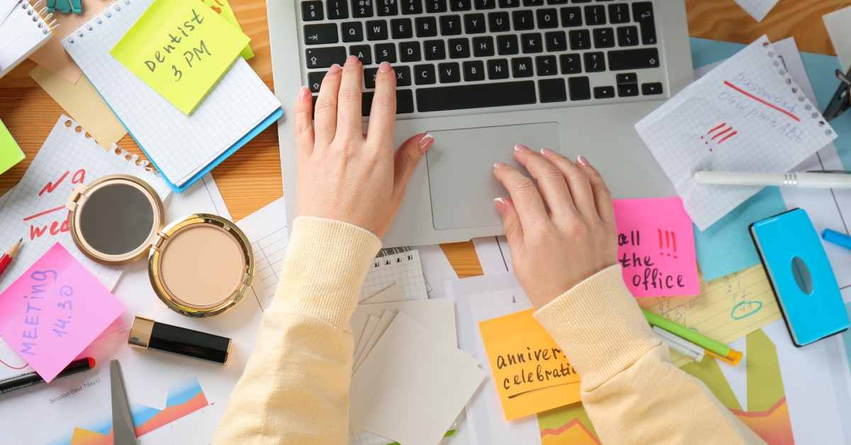 woman using laptop at messy table