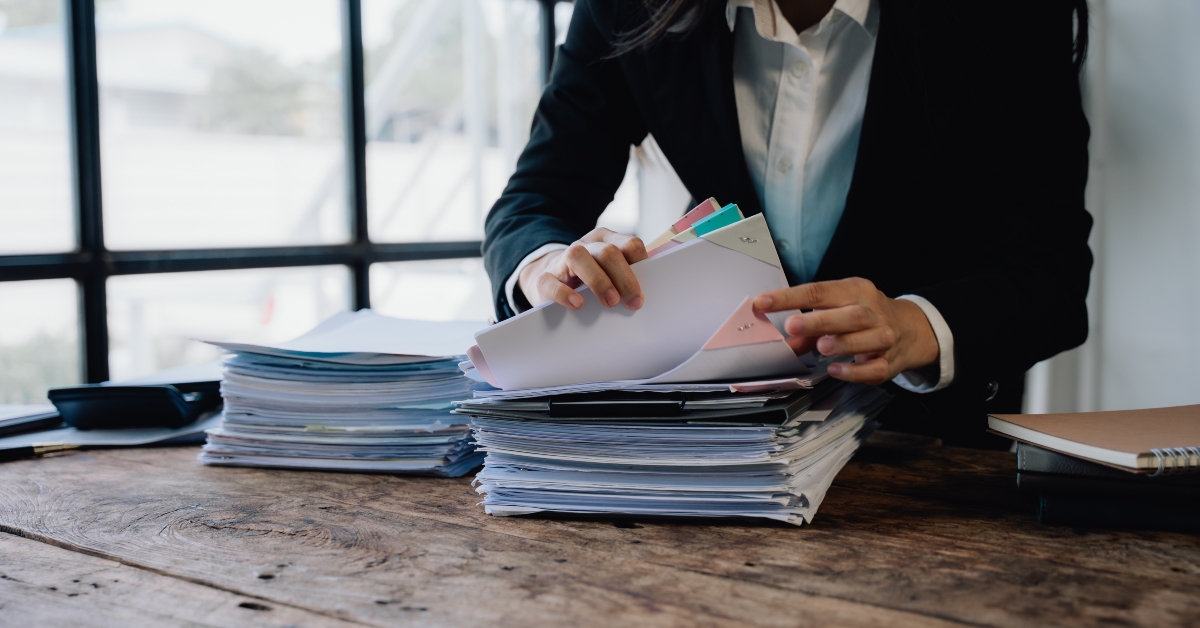businesswoman organizing documents