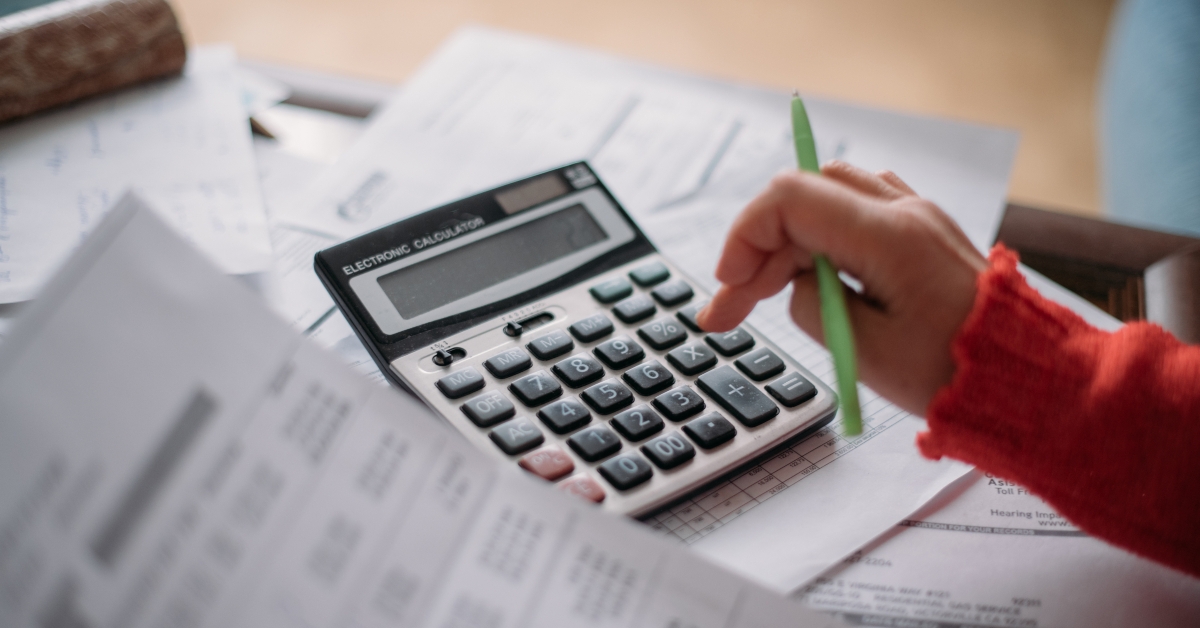 woman using calculator for computing bills