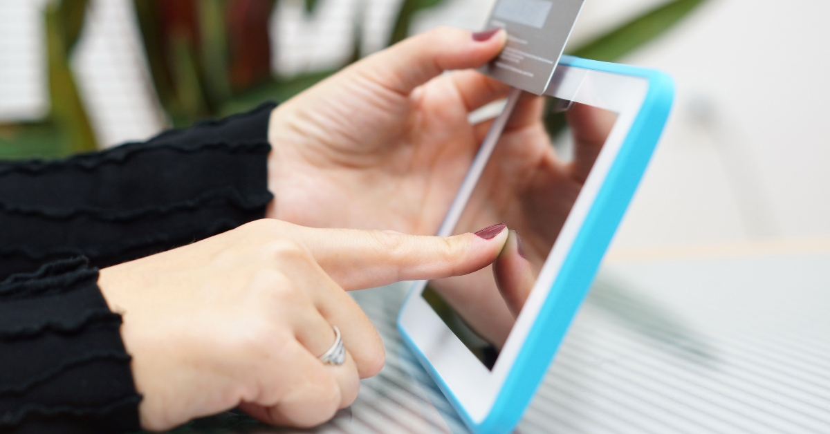 Woman holding tablet pc and credit card