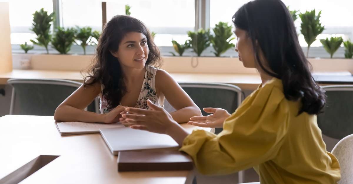 colleagues engaged in discussion during meeting