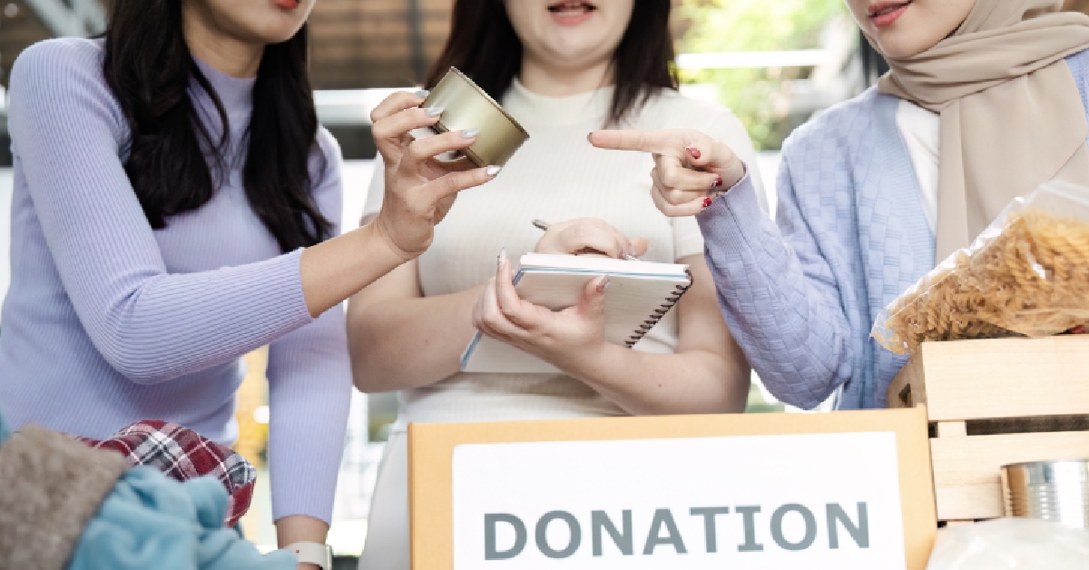 women discussing donation items