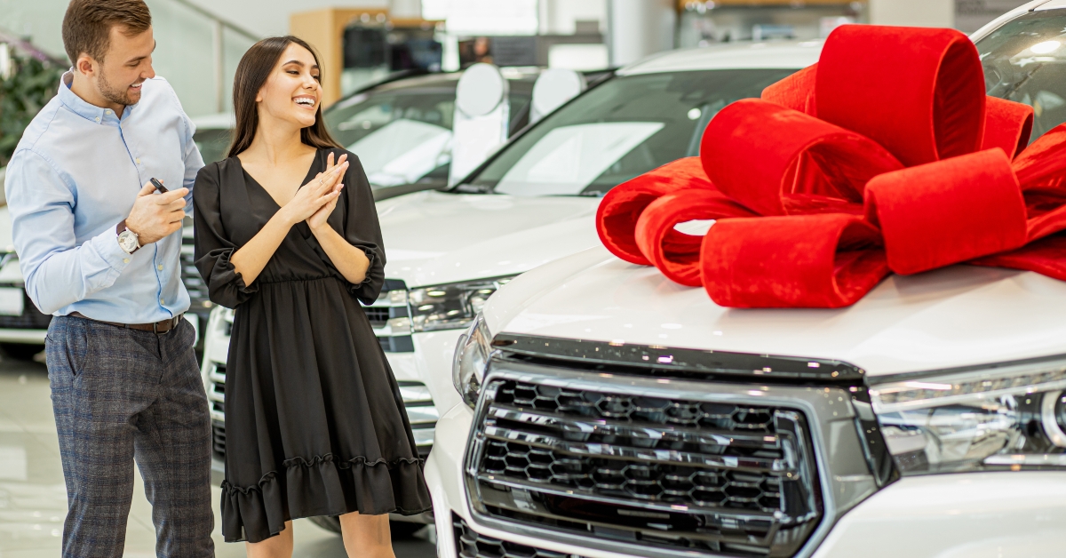 couple with new automobile