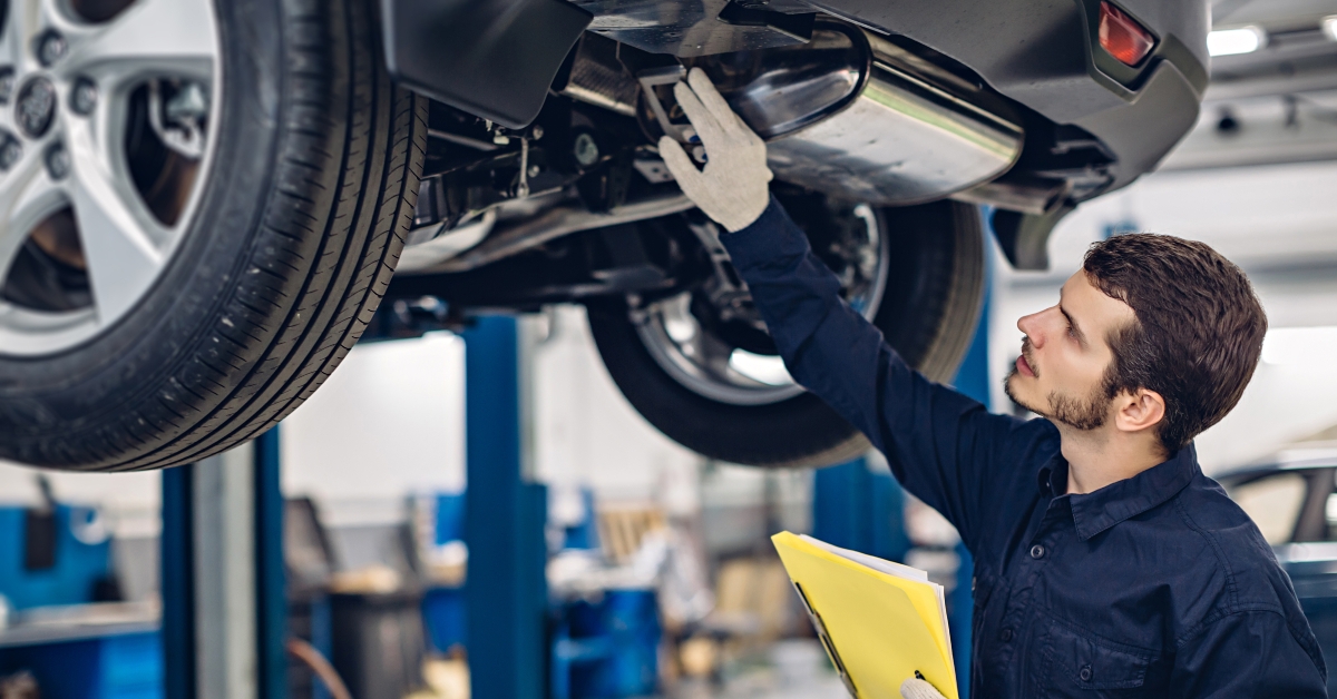 Mechanic examining car